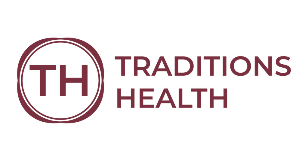 Traditions Health logo featuring the letters "TH" enclosed in a circular border on the left and the words "Traditions Health" in bold maroon letters on the right.